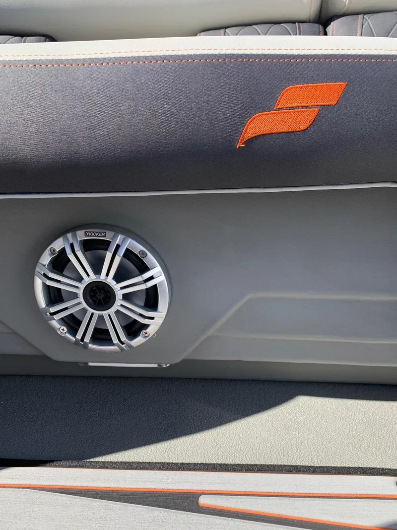 Slide: The Image of 2024 Starcraft SLS3 boat interior with speaker and logo. - 8