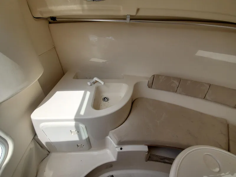 Slide: The Image of Interior cabin of a 2004 Wellcraft 252 Coastal boat with sink and seating area. - 15