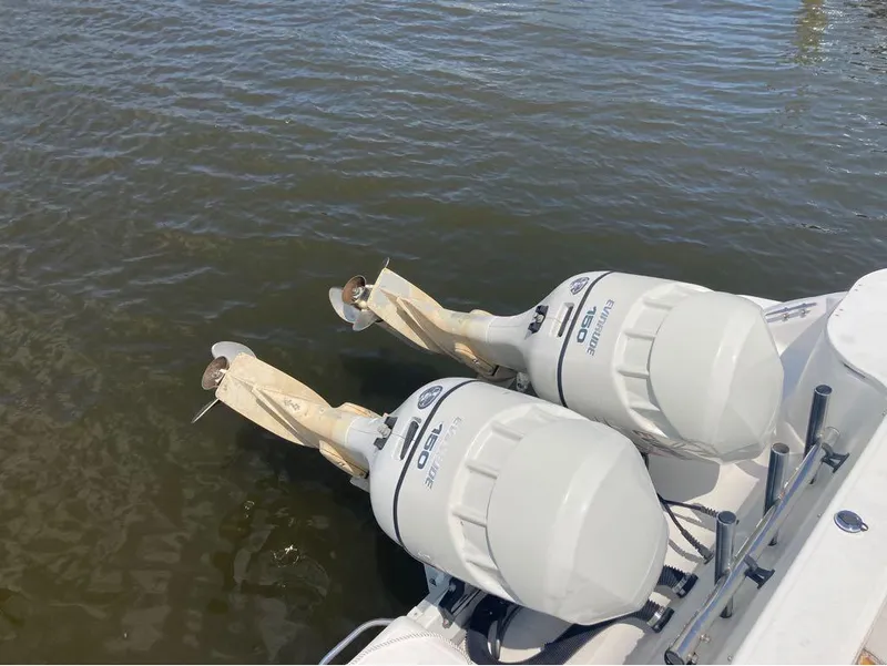 Slide: The Image of Twin Evinrude 150 outboard motors on a 2004 Wellcraft 252 Coastal boat. - 2