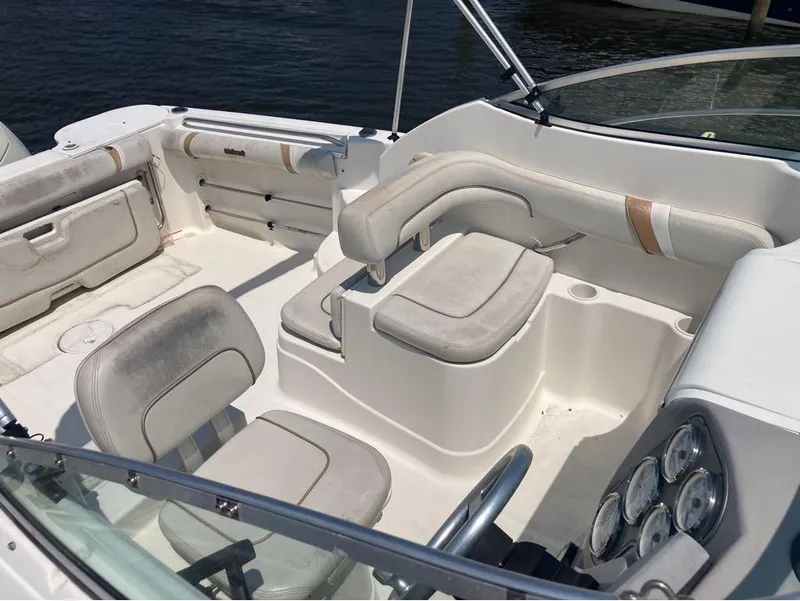 Slide: The Image of 2004 Wellcraft 252 Coastal boat interior with seating and dashboard. - 3