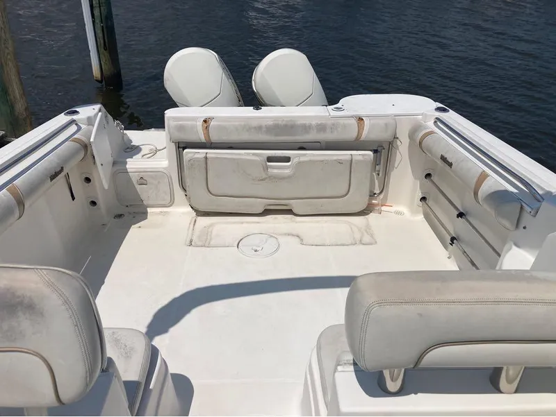 Slide: The Image of 2004 Wellcraft 252 Coastal boat interior with seating and storage compartments. - 4