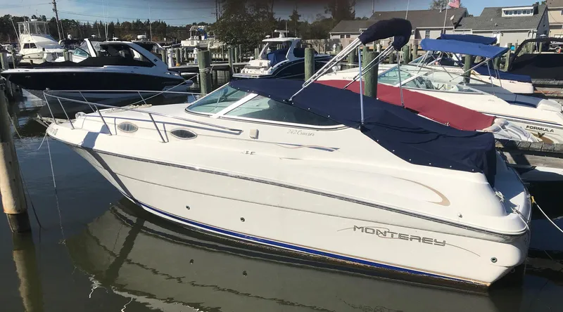 The Image of 2000 Monterey 242 Cruiser boat docked at a marina. - 1