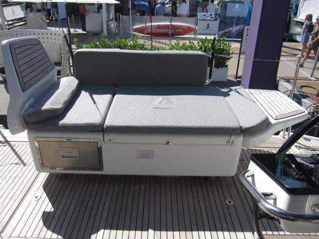 Slide: The Image of Jeanneau Yacht 65 (2025) deck with cushioned seating and storage compartments. - 38