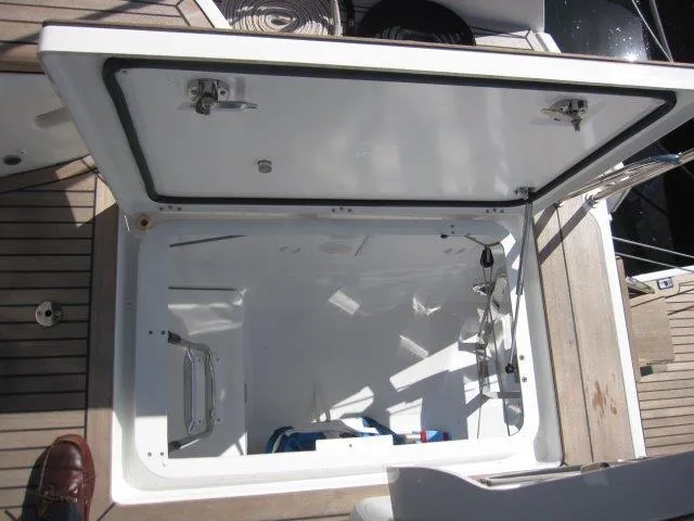 Slide: The Image of Open storage compartment on 2025 Jeanneau Yacht 65 deck. - 43