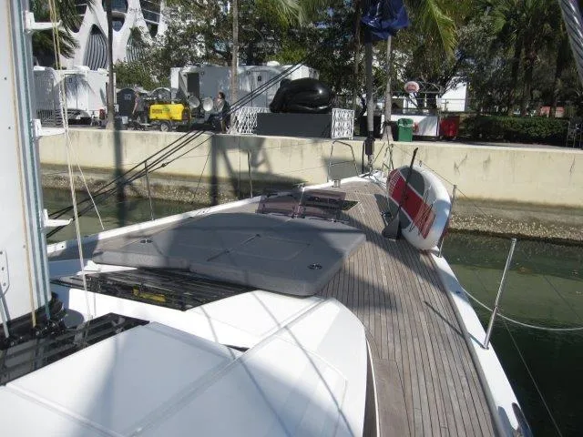 Slide: The Image of 2025 Jeanneau Yacht 65 docked, showcasing sleek deck design and modern amenities. - 23