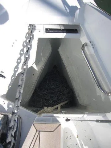 Slide: The Image of Anchor locker of 2025 Jeanneau Yacht 65 with chain and rope. - 26