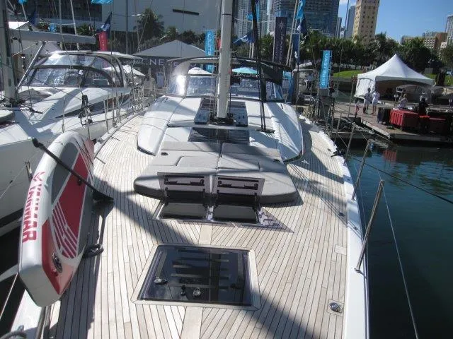 Slide: The Image of 2025 Jeanneau Yacht 65 deck view at marina. - 28