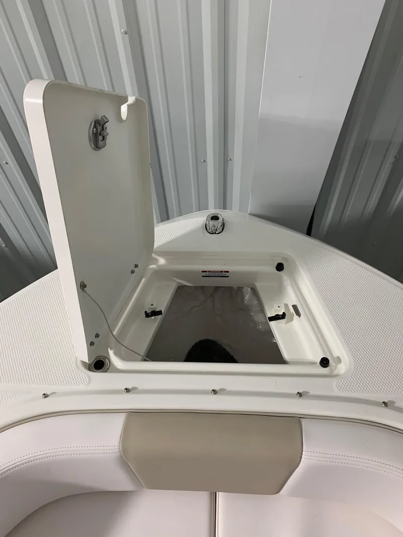 Slide: The Image of 2024 Robalo R207 Dual Console boat storage compartment. - 17