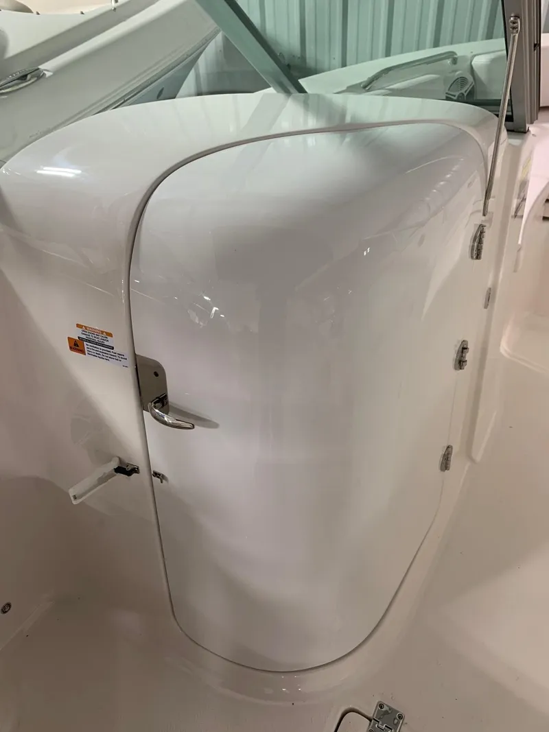Slide: The Image of 2024 Robalo R207 Dual Console boat interior detail with white finish. - 10