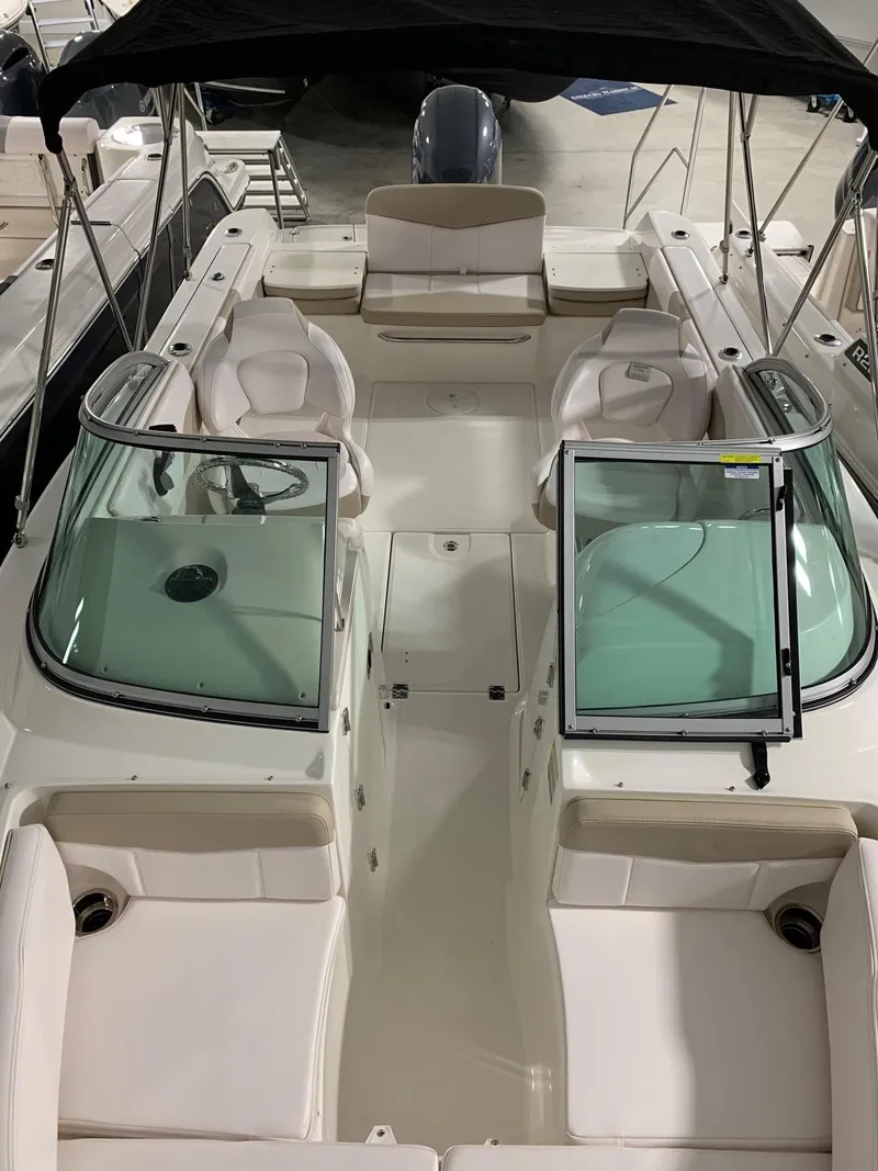 Slide: The Image of 2024 Robalo R207 Dual Console boat with spacious seating and modern design. - 15