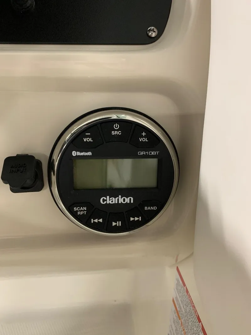 Slide: The Image of Clarion audio system in 2024 Robalo R207 Dual Console boat. - 6