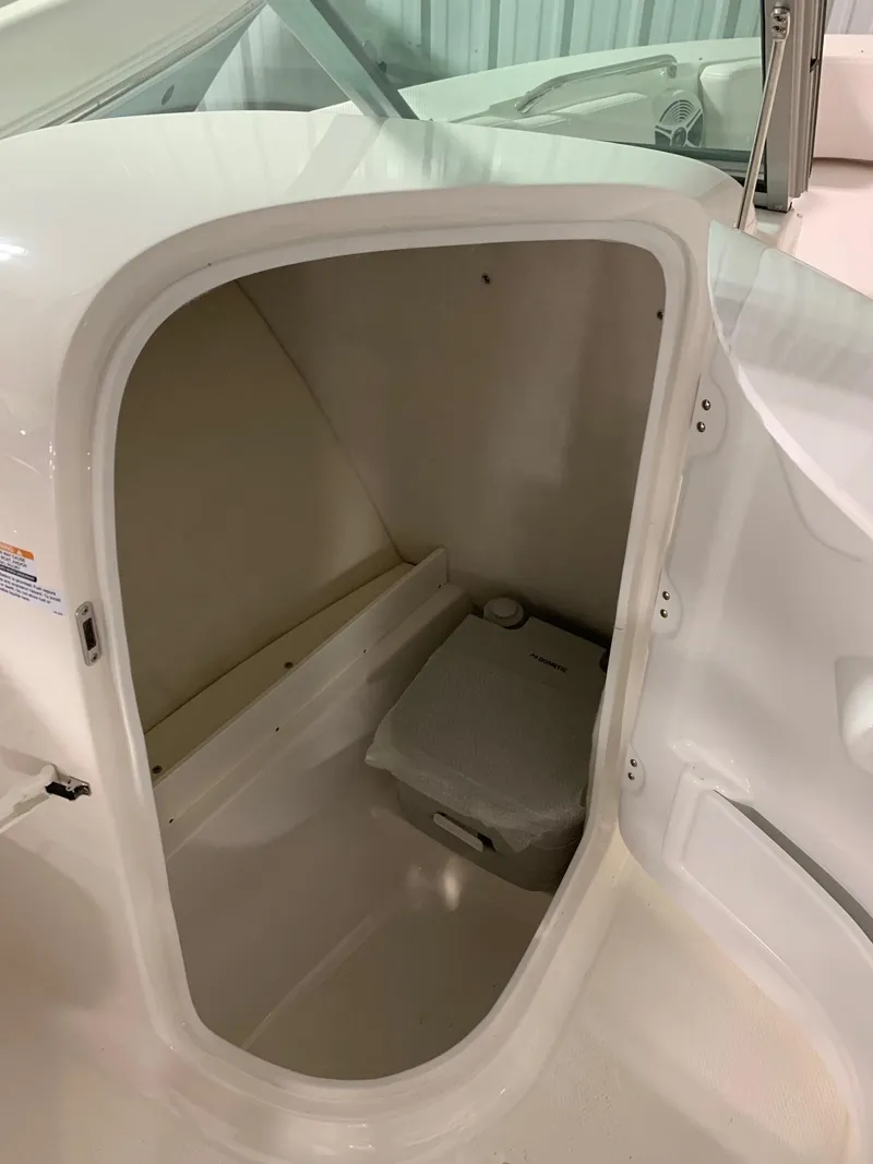 Slide: The Image of 2024 Robalo R207 Dual Console boat storage compartment. - 9