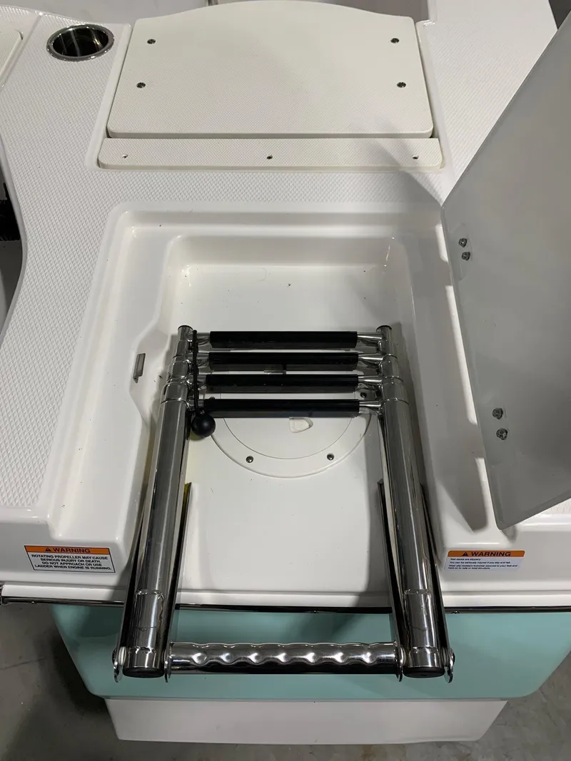 Slide: The Image of 2024 Robalo 206 Cayman boat with built-in retractable ladder. - 20