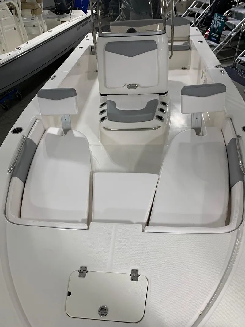 Slide: The Image of 2024 Robalo 206 Cayman boat interior with seating and storage compartments. - 21