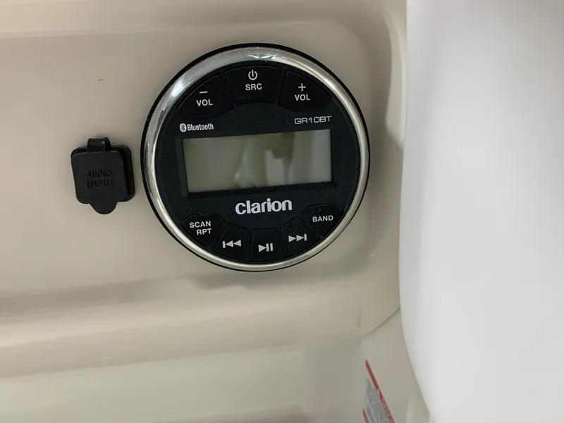 Slide: The Image of Clarion audio system in 2024 Robalo R207 Dual Console boat. - 13