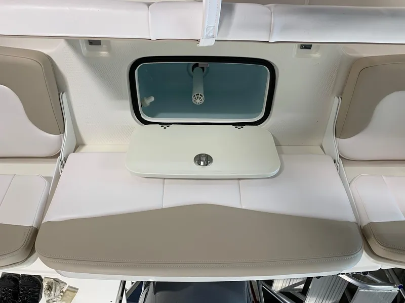 Slide: The Image of 2024 Robalo R207 Dual Console boat interior with seating and storage. - 17