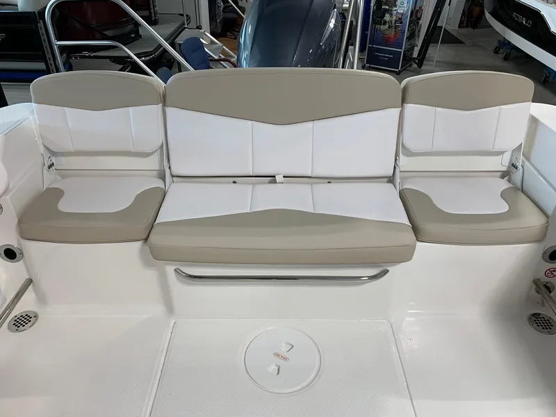 Slide: The Image of 2024 Robalo R207 Dual Console boat with beige and white seating. - 18
