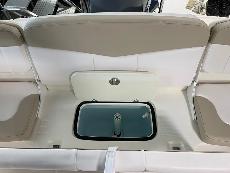 Slide: The Image of 2024 Robalo R207 Dual Console boat seating and storage compartment. - 16