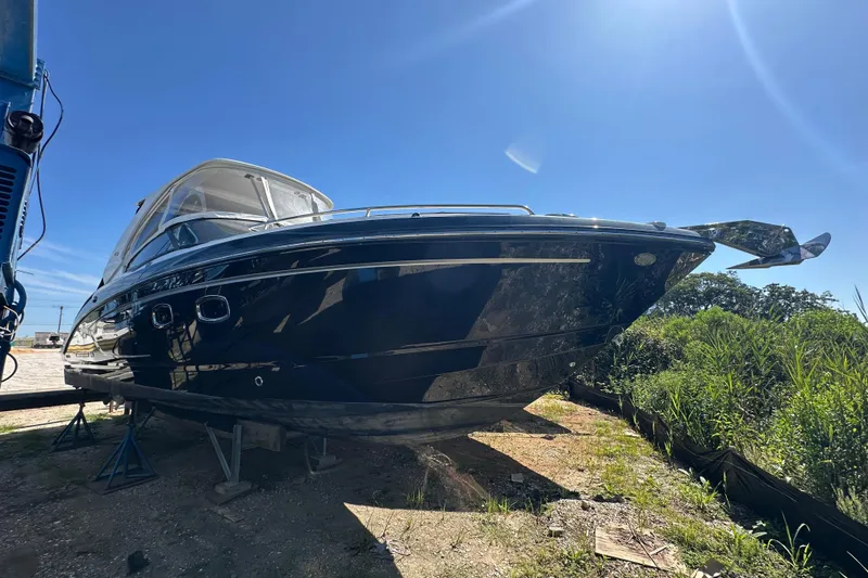 Slide: The Image of 2019 Chaparral 347 SSX boat on land under clear blue sky. - 0