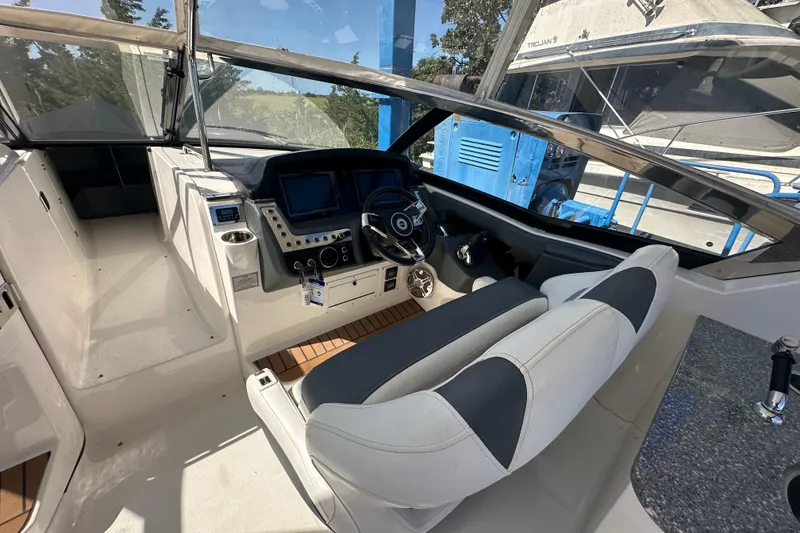 Slide: The Image of 2019 Chaparral 347 SSX boat cockpit with modern controls and comfortable seating. - 15