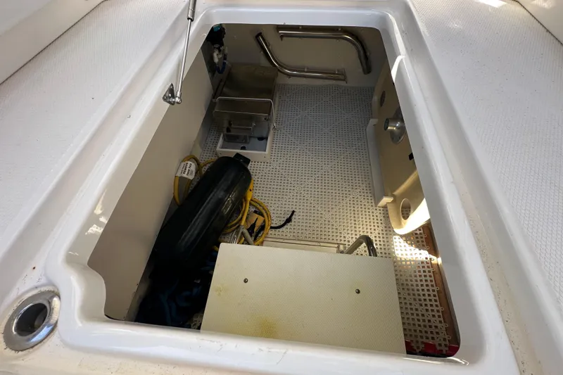Slide: The Image of Storage compartment of a 2019 Chaparral 347 SSX boat, featuring equipment and accessories. - 17