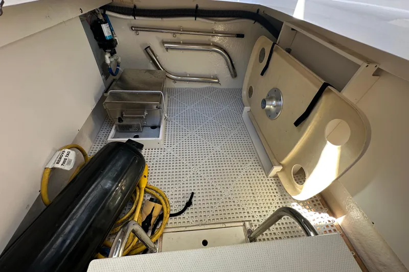 Slide: The Image of Interior of a 2019 Chaparral 347 SSX boat, featuring storage and equipment. - 18