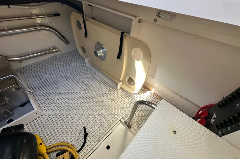 Slide: The Image of Interior of a 2019 Chaparral 347 SSX boat, featuring storage and utility areas. - 19