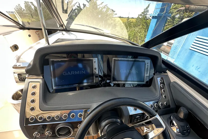 Slide: The Image of 2019 Chaparral 347 SSX dashboard with Garmin navigation screens and control panel. - 30