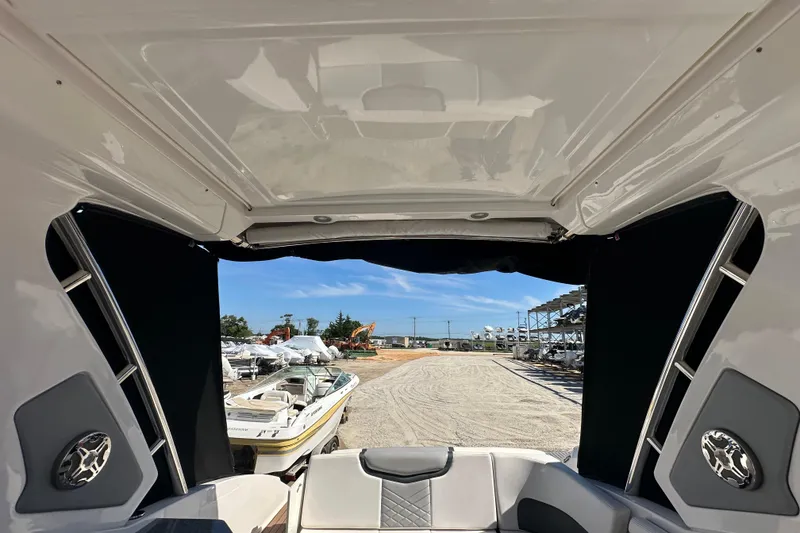 Slide: The Image of 2019 Chaparral 347 SSX boat interior with open view of marina and boats. - 33