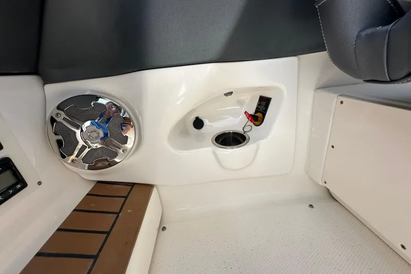 Slide: The Image of 2019 Chaparral 347 SSX boat interior with speaker and control panel. - 38