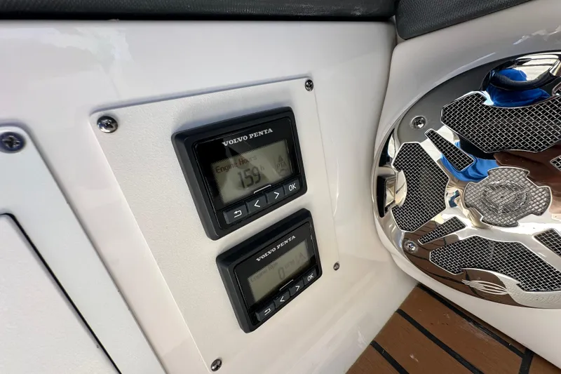 Slide: The Image of Volvo Penta engine hour meters on 2019 Chaparral 347 SSX boat dashboard. - 40