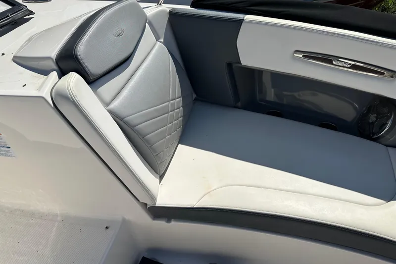Slide: The Image of 2019 Chaparral 347 SSX boat interior with gray and white seating. - 42