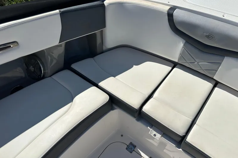 Slide: The Image of 2019 Chaparral 347 SSX boat interior with cushioned seating and sleek design. - 43