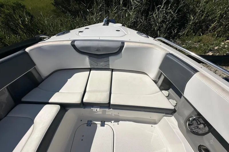 Slide: The Image of 2019 Chaparral 347 SSX boat interior with cushioned seating and sleek design. - 44