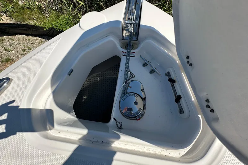 Slide: The Image of Anchor compartment of 2019 Chaparral 347 SSX boat with chain and winch. - 45