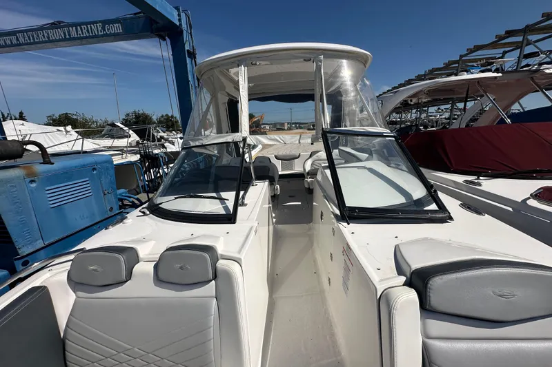Slide: The Image of 2019 Chaparral 347 SSX boat docked, featuring sleek design and spacious seating. - 47