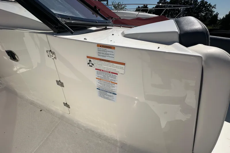 Slide: The Image of 2019 Chaparral 347 SSX boat interior with safety warning labels. - 49