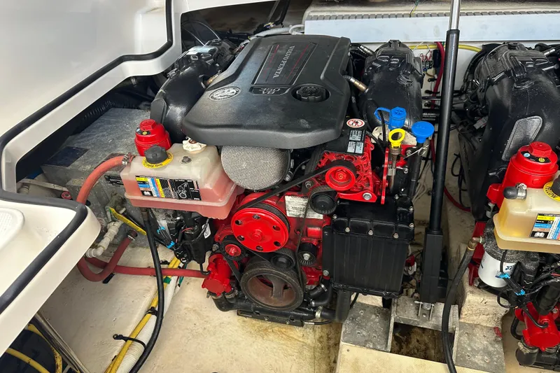 Slide: The Image of Engine compartment of a 2019 Chaparral 347 SSX boat, showcasing detailed components. - 50