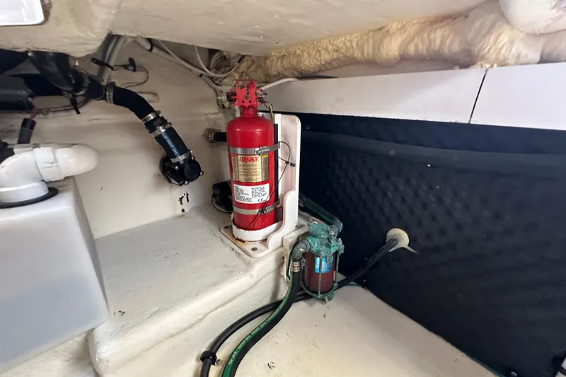 Slide: The Image of Engine compartment of 2019 Chaparral 347 SSX with fire extinguisher and hoses. - 56