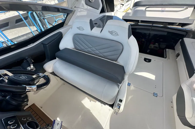 Slide: The Image of 2019 Chaparral 347 SSX boat interior with steering wheel and seating area. - 57