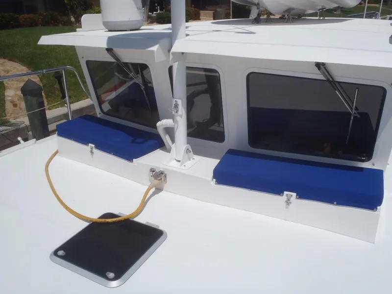 Slide: The Image of 2025 Great Harbour N40 boat deck with blue cushions and windows. - 12