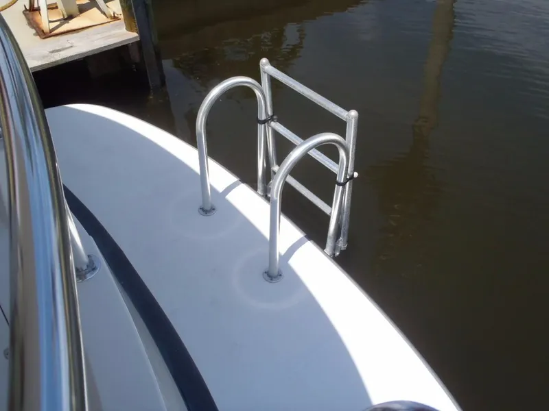 Slide: The Image of Stainless steel swim ladder on 2025 Great Harbour N40 boat, docked in calm water. - 13