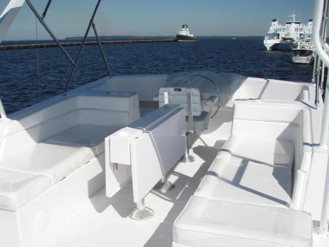 Slide: The Image of Great Harbour N40 yacht deck, 2025 model, with white seating and ocean view. - 14