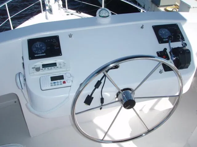 Slide: The Image of Steering console of 2025 Great Harbour N40 boat with navigation instruments and controls. - 17