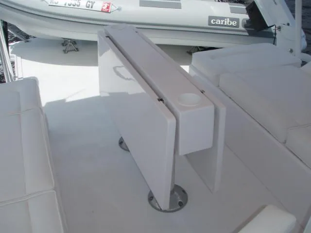Slide: The Image of Foldable table on 2025 Great Harbour N40 yacht deck, with seating and inflatable boat nearby. - 19