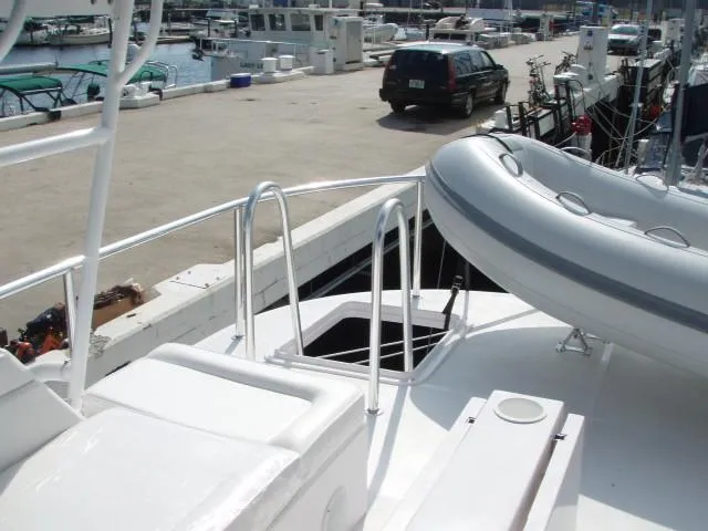 Slide: The Image of Great Harbour N40 yacht deck with inflatable boat, docked at marina, 2025 model. - 22