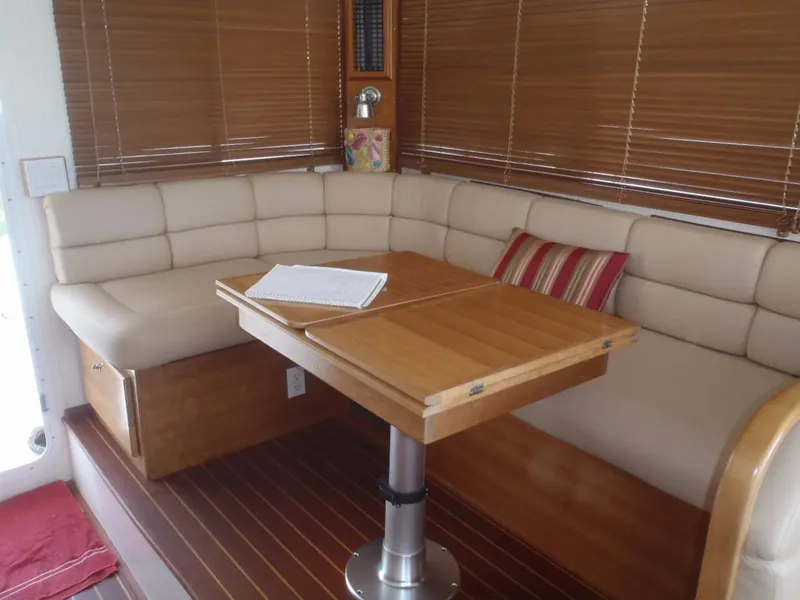 Slide: The Image of Interior of 2025 Great Harbour N40 yacht with cozy seating and wooden table. - 25