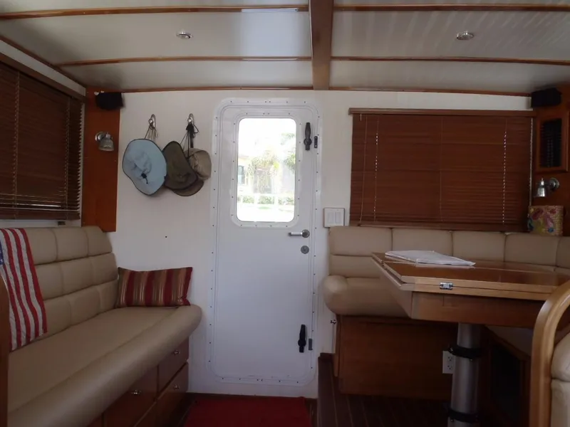 Slide: The Image of Interior of 2025 Great Harbour N40 yacht with beige seating and wooden accents. - 26