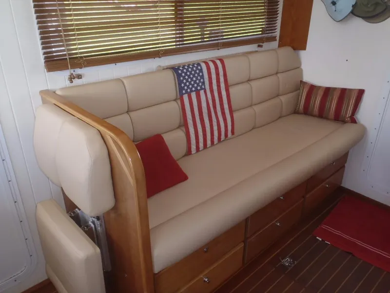 Slide: The Image of Luxurious beige sofa with American flag pillow in 2025 Great Harbour N40 yacht interior. - 27