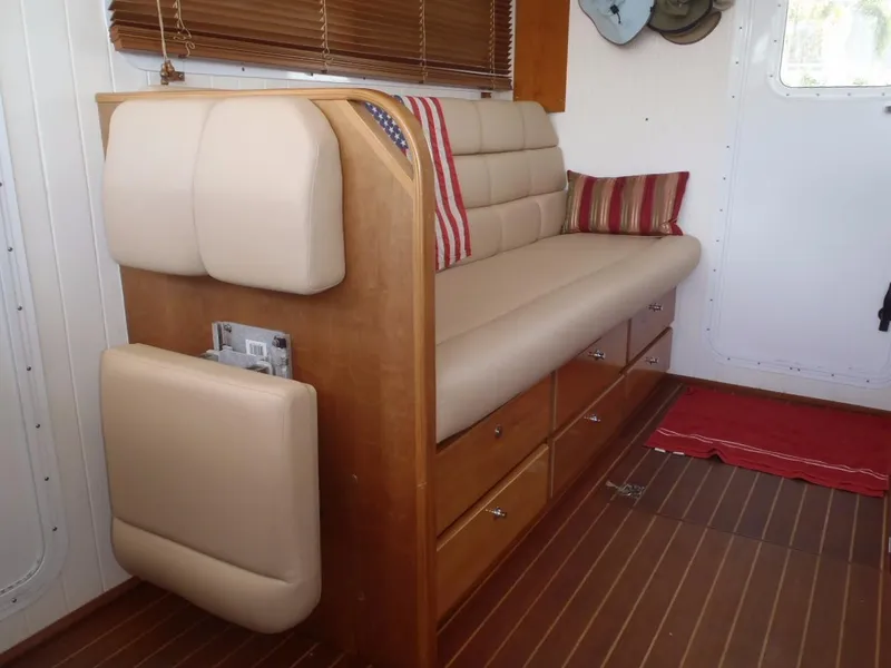Slide: The Image of Interior of 2025 Great Harbour N40 yacht with beige seating and wooden storage drawers. - 29
